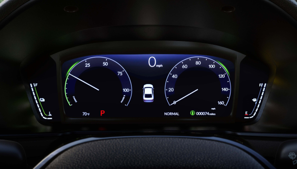 Closeup of TFT screen seen through the steering wheel. 