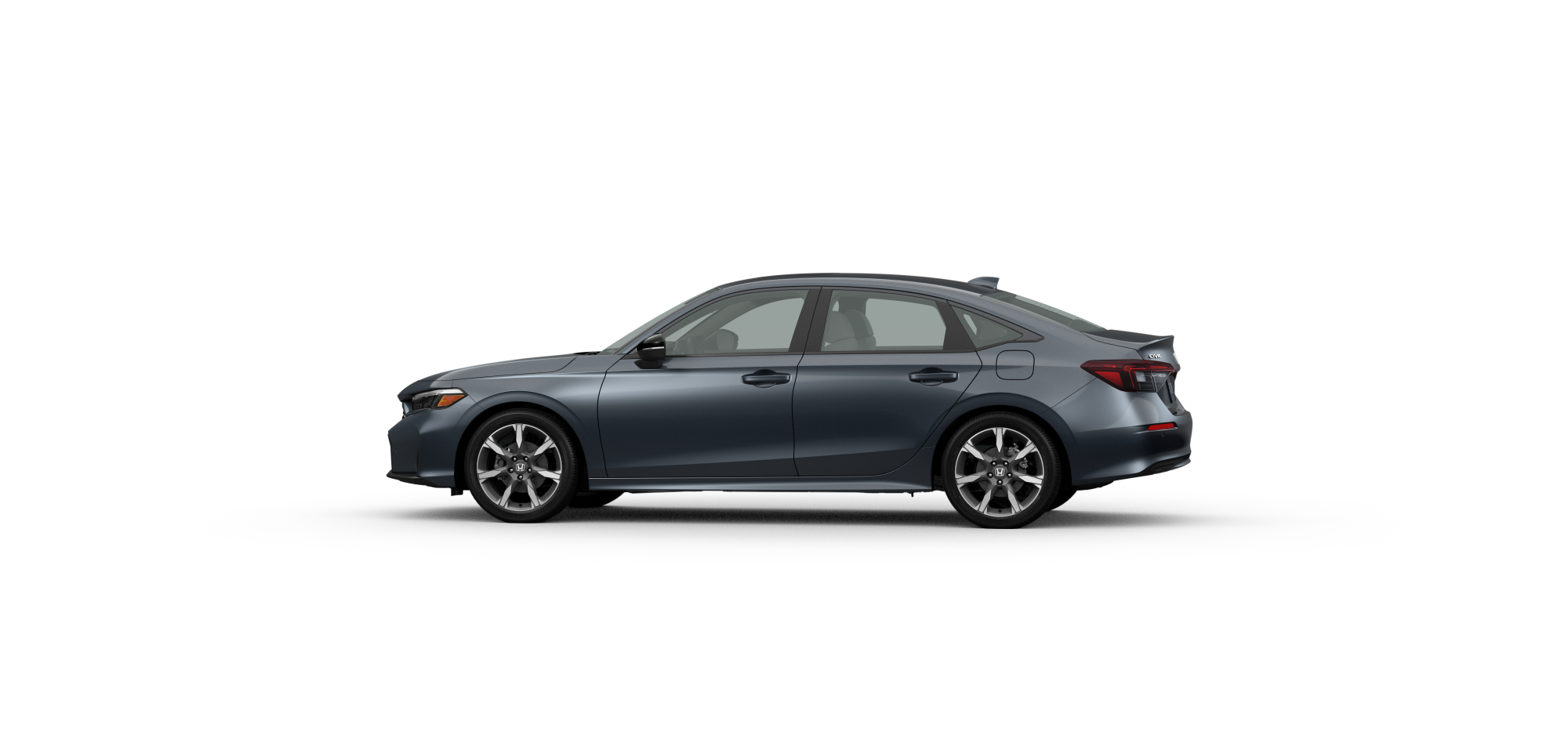Side driver-side view of 2025 Civic Hatchback Sport Touring Hybrid  in Meteoroid Grey Metallic colour on white space. 