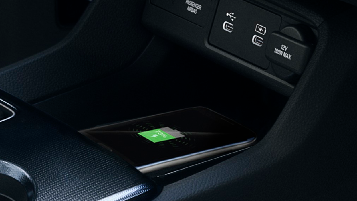 Closeup of phone charging on wireless charging pad.