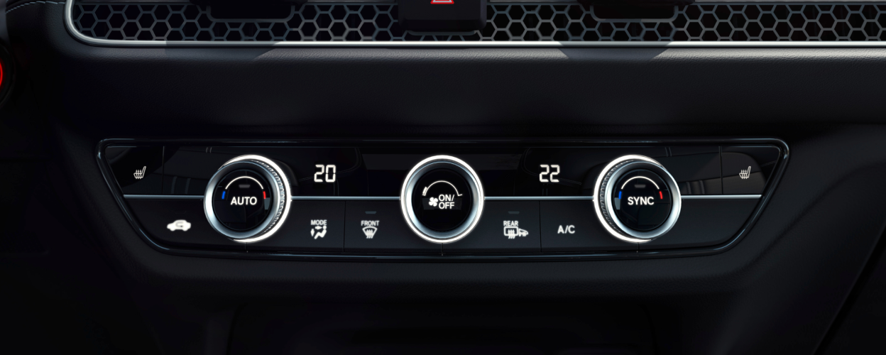 Closeup of climate control dials. 