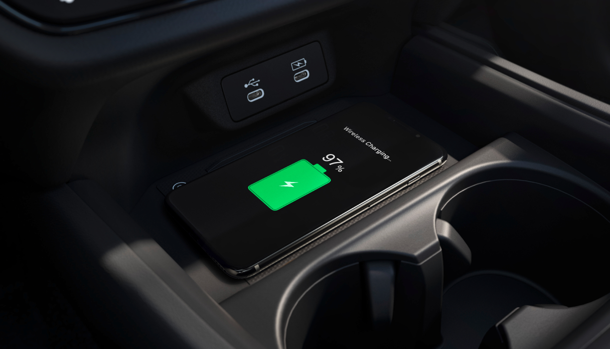 Closeup of phone charging on wireless charging pad.