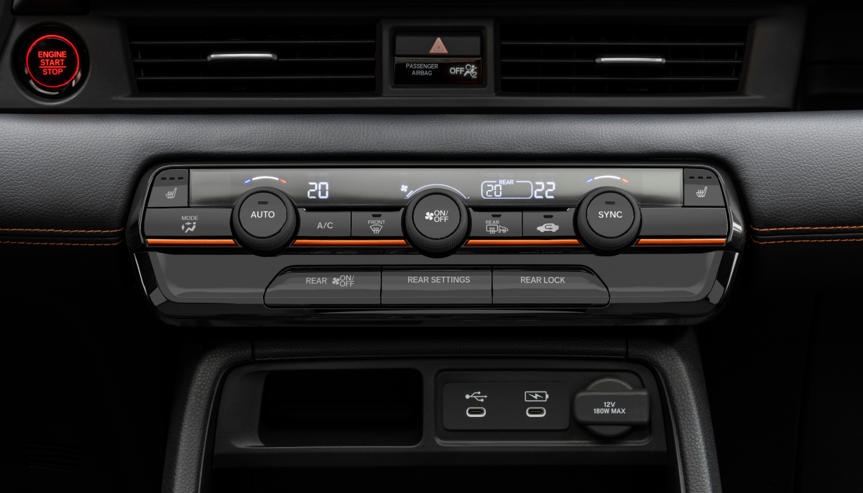 Closeup of the Pilot’s climate control panel, with buttons and dials for temperature adjustment.