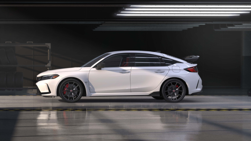 Side view of white Typr R in an auto hangar.